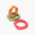 Beach Rose Co. 3-pack of glossy resin bangles in orange, green, and red with a smooth, rounded square design.