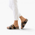Beach Rose Co. Jenesis retro platform slippers with black and tan straps on a model wearing white cropped trousers.