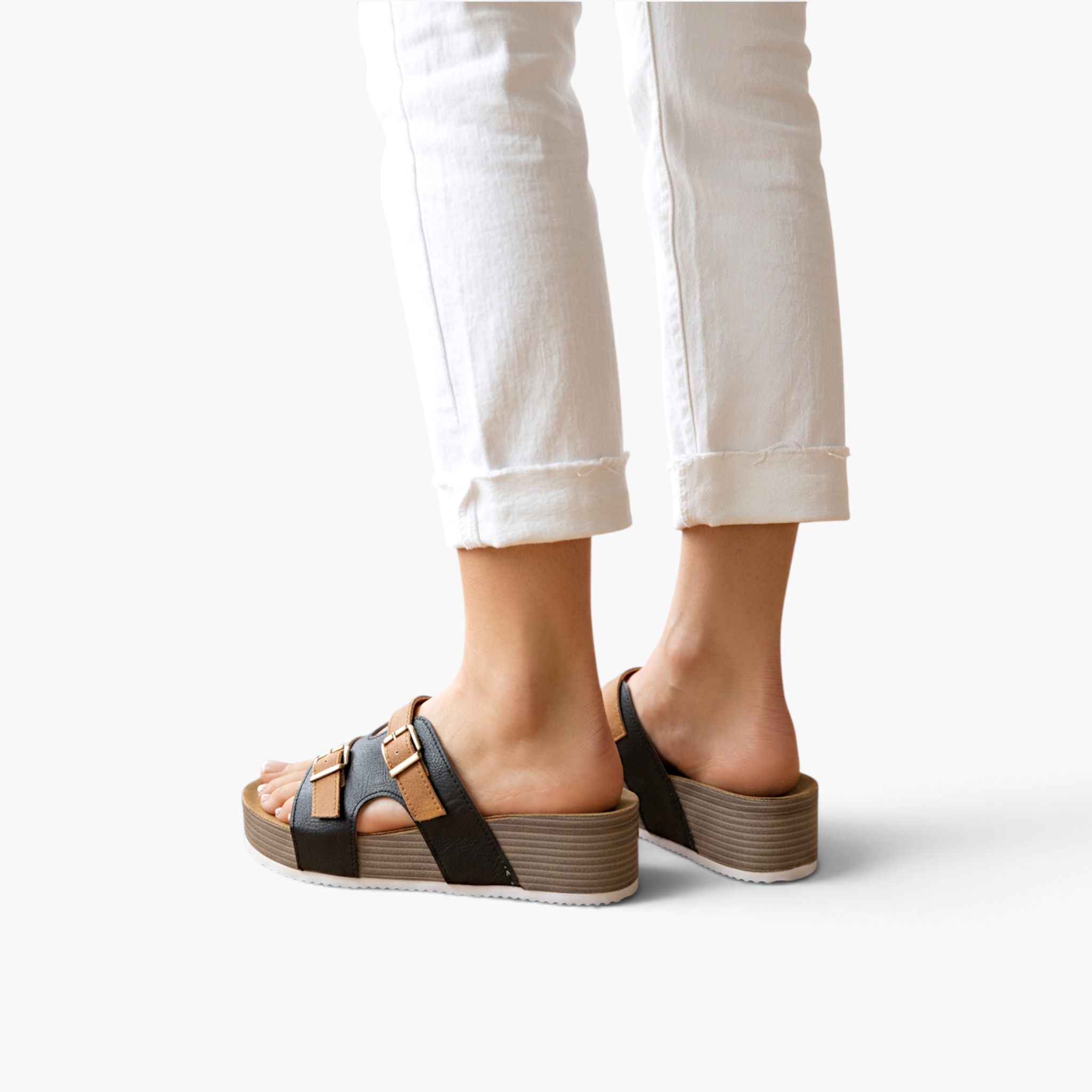 Beach Rose Co. Jenesis retro platform slippers with black and tan straps worn with white cropped jeans