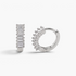 Beach Rose Co. rhodium-filled huggie hoop earrings featuring a row of sparkling baguette-cut cubic zirconia stones.