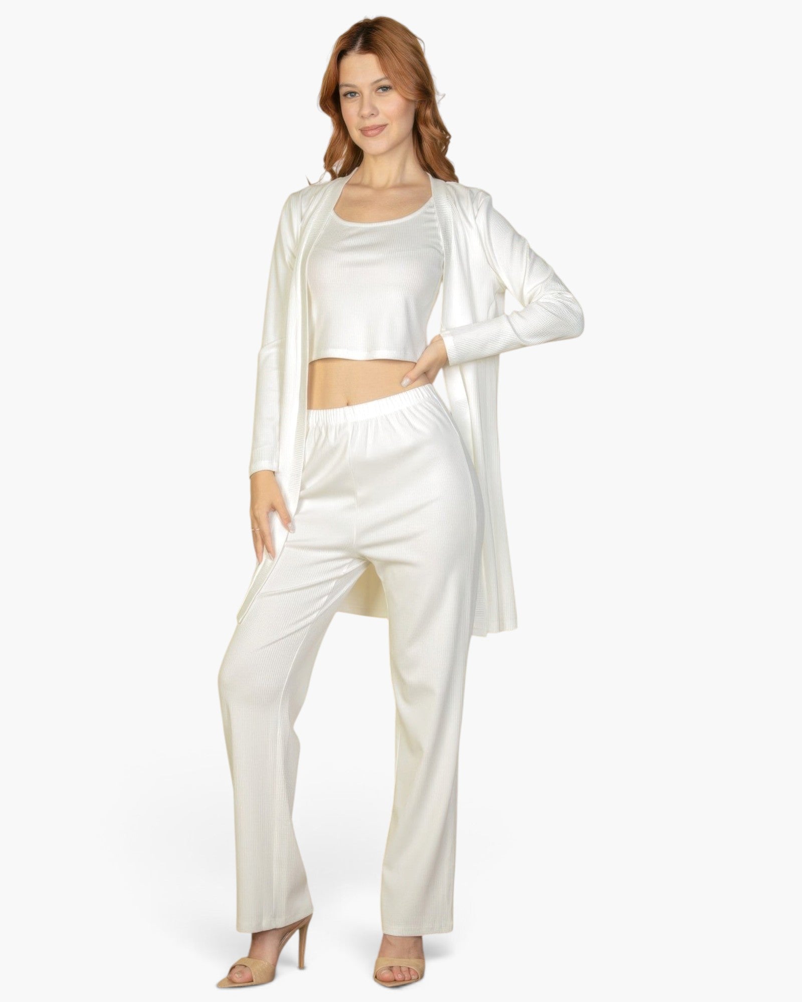 Beach Rose Co. off-white three-piece ribbed cami top, straight-leg pants, and long cardigan loungewear set on a model.