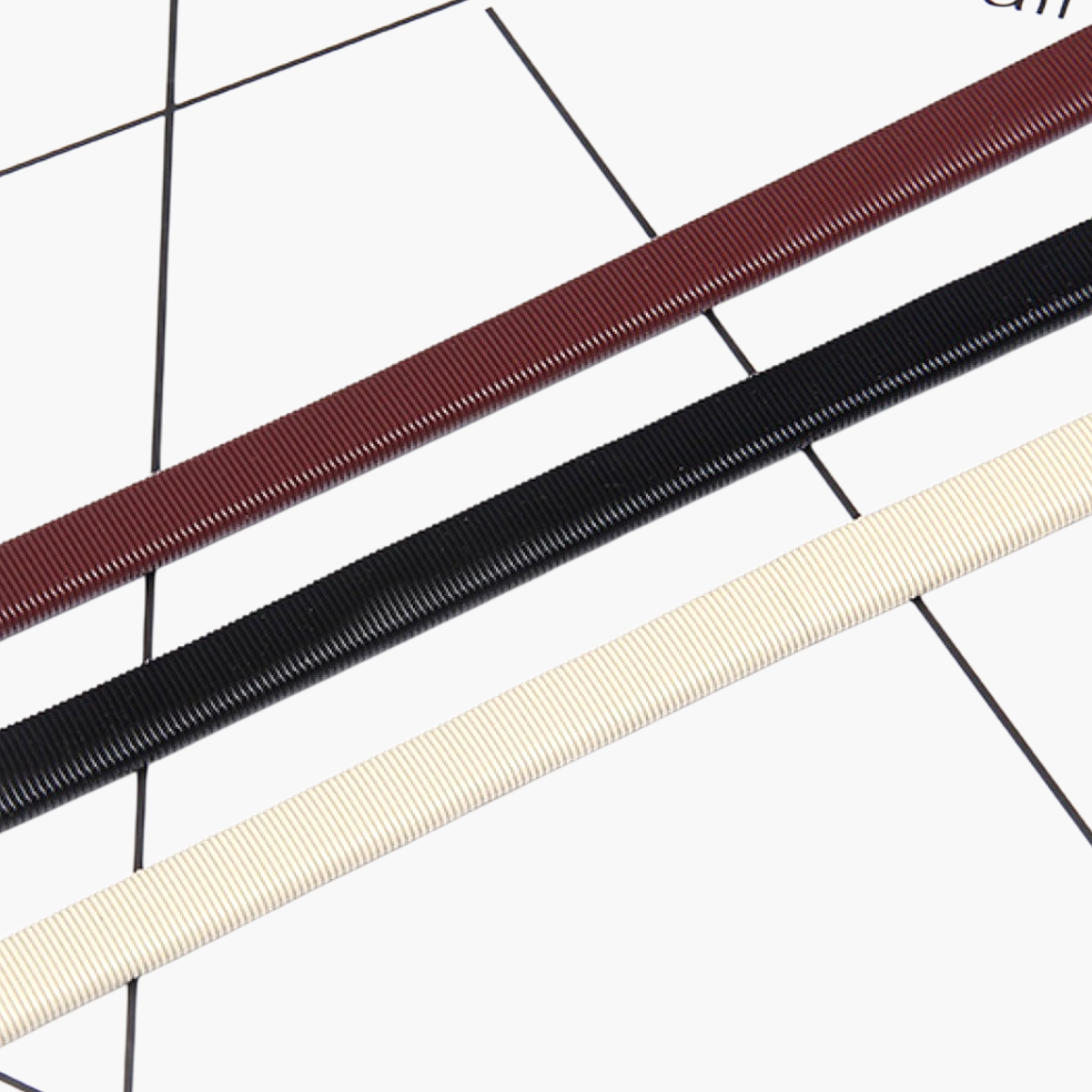 Beach Rose Co. skinny metal waist belts in burgundy, black, and beige with a finely ribbed stretch design.
