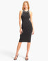 Model wearing a black Beach Rose Co. ribbed cotton sleeveless midi dress with white contrasting trim.