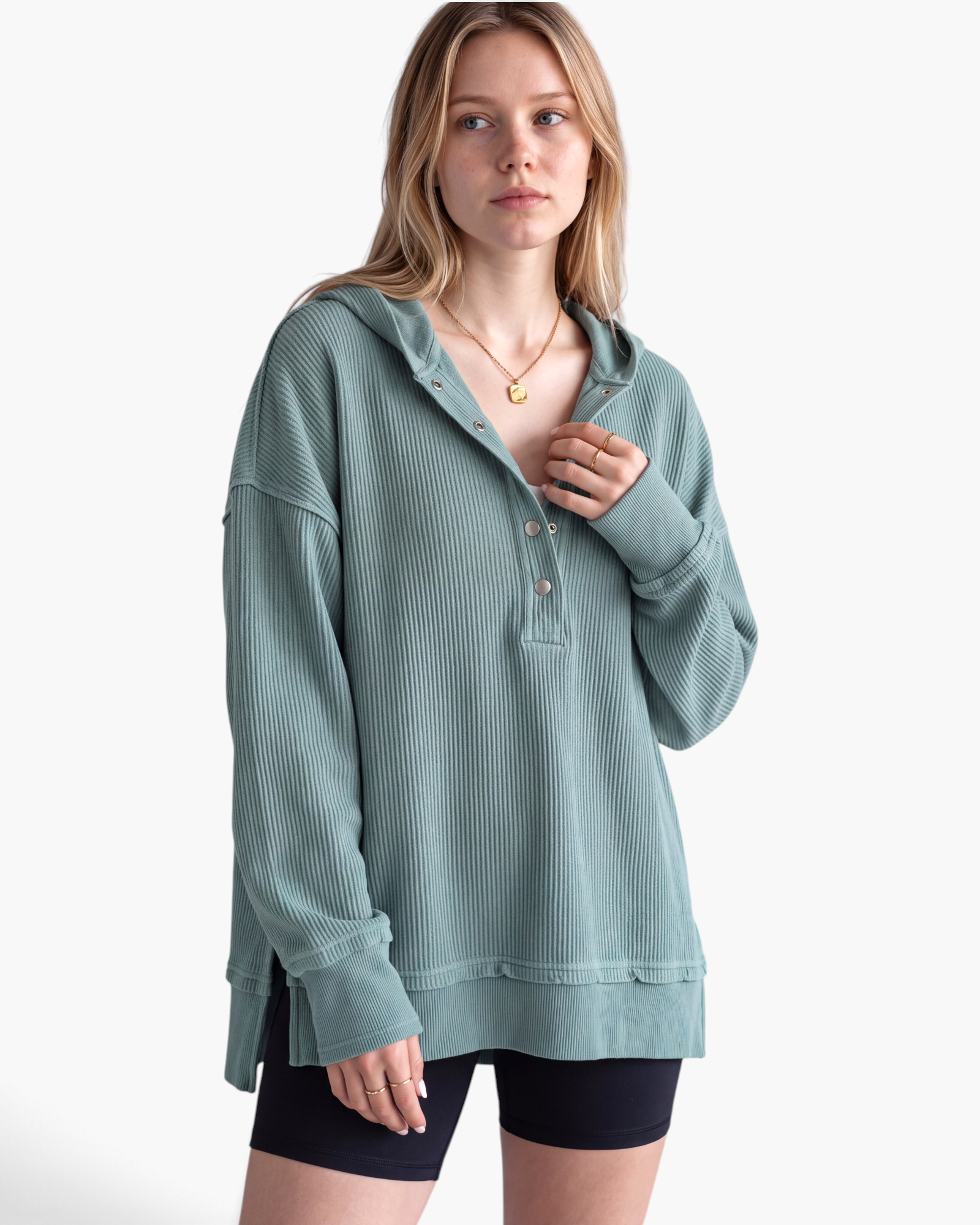 Beach Rose Co. sage green ribbed hooded pullover with a snap-front placket and dropped shoulders on a model.