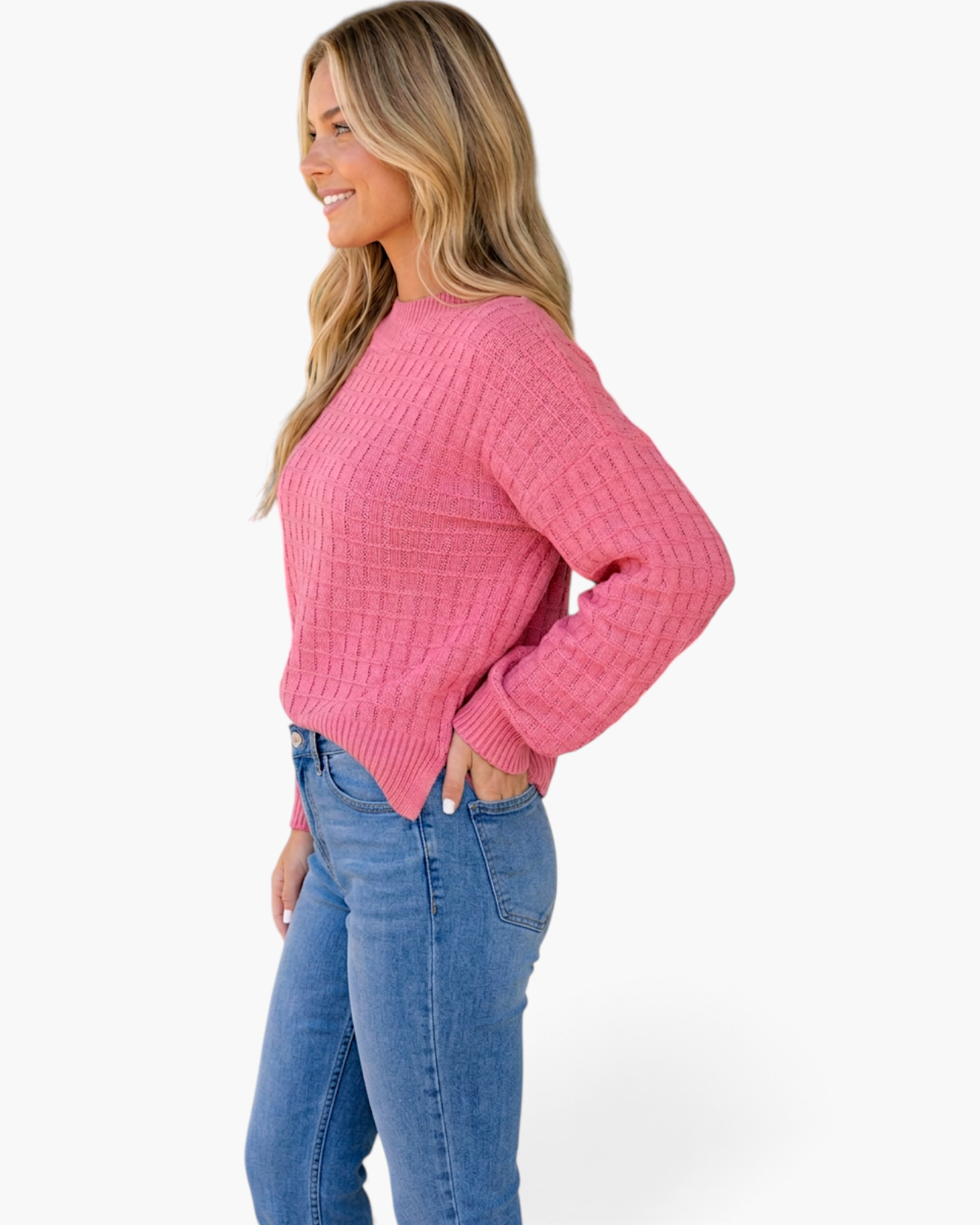 Beach Rose Co. rose pink long-sleeve sweater with a textured grid-knit pattern and ribbed trim worn with blue jeans.