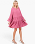 Beach Rose Co. rose tiered shift dress with split neckline and long bell sleeves worn by a blonde model