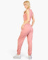 Beach Rose Co. rosewood pink French terry tank top and joggers set worn by a blonde model on a white background.