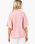 Back view of Beach Rose Co. rosewood textured blouse with relaxed dolman sleeves and a collared neckline.