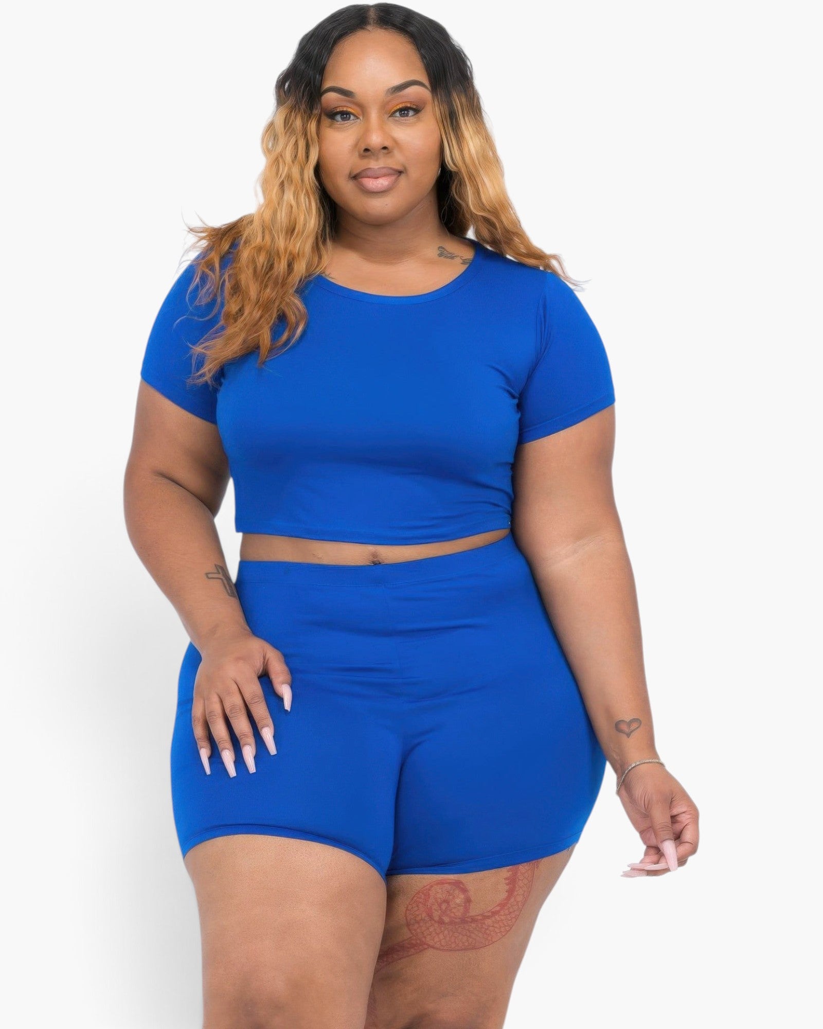 Beach Rose Co. plus size model wearing a royal blue short sleeve crop top and matching shorts set in jersey fabric