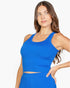 Beach Rose Co. royal blue ribbed tank top worn by a woman with long brown hair, featuring a form-fitting design.