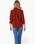Beach Rose Co. rust corduroy button-front shirt with long sleeves and a curved hem worn by a blonde model