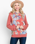 Beach Rose Co. rust floral print hoodie with a relaxed fit, long sleeves, and drawstring hood on a smiling model.