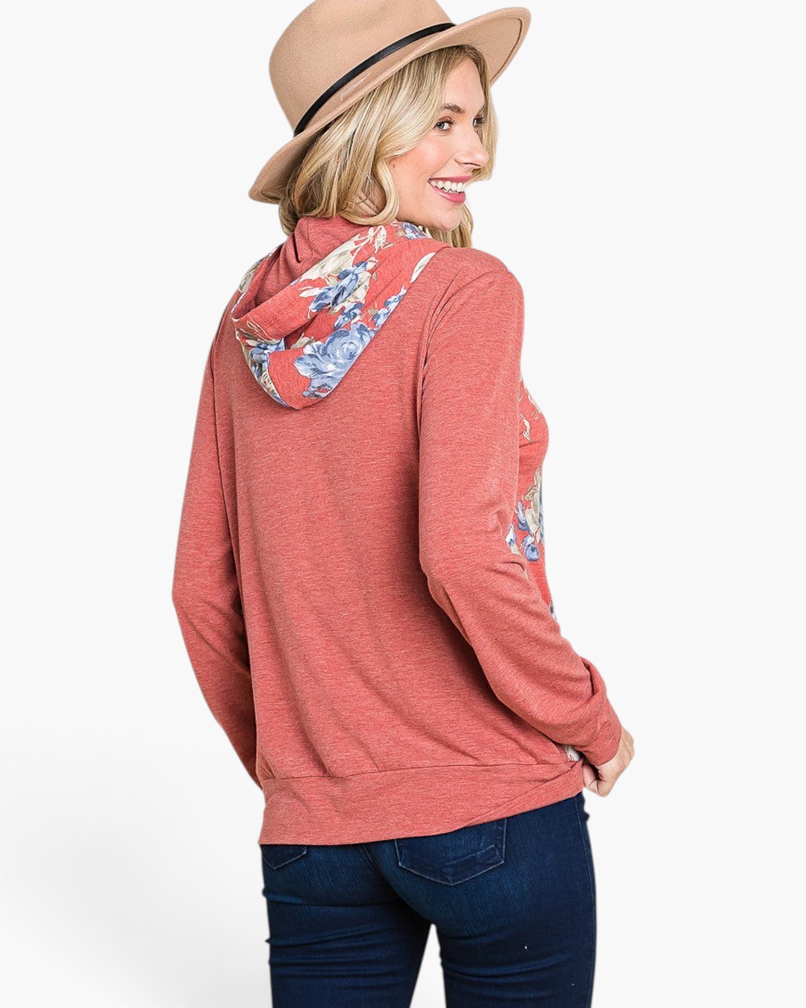 Beach Rose Co. rust floral print hoodie with relaxed fit and cuff detail worn by a woman in a hat