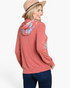 Beach Rose Co. rust floral print hoodie with relaxed fit and cuff detail worn by a woman in a hat