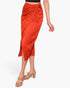 Beach Rose Co. rust orange washed satin crepe midi skirt with a side wrap tie closure and elegant draped silhouette.