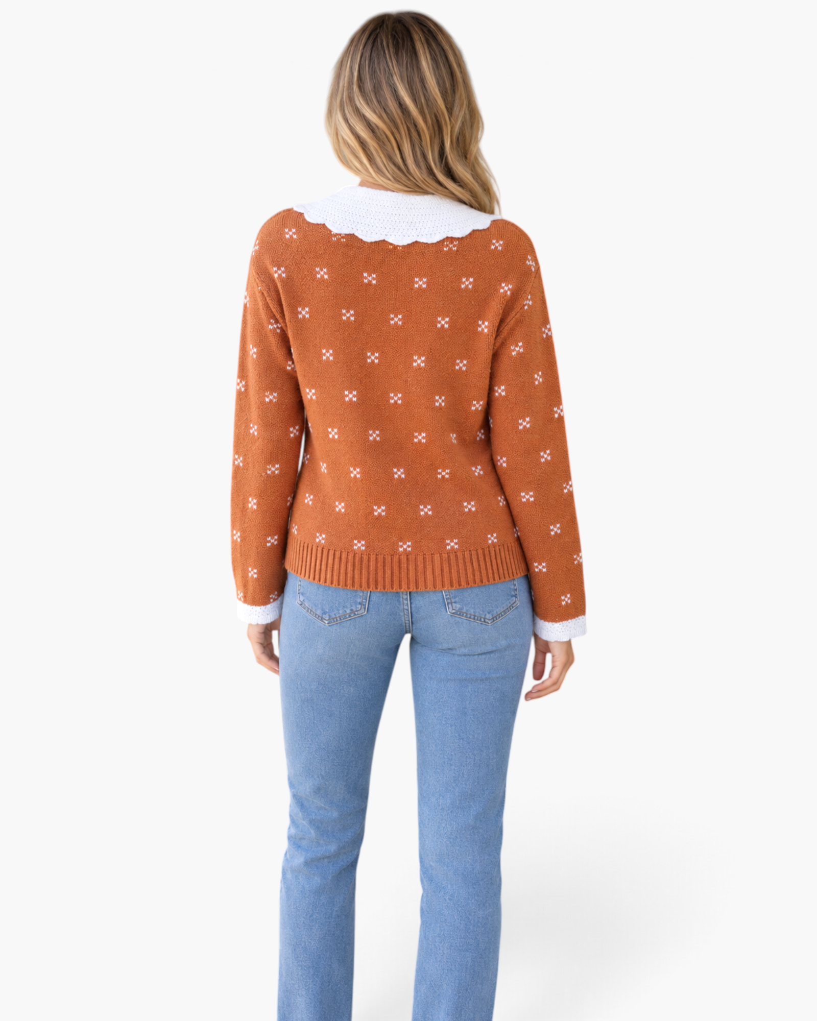 Beach Rose Co. rust cardigan with white knit motifs and a scalloped collar, shown from the back on a model.