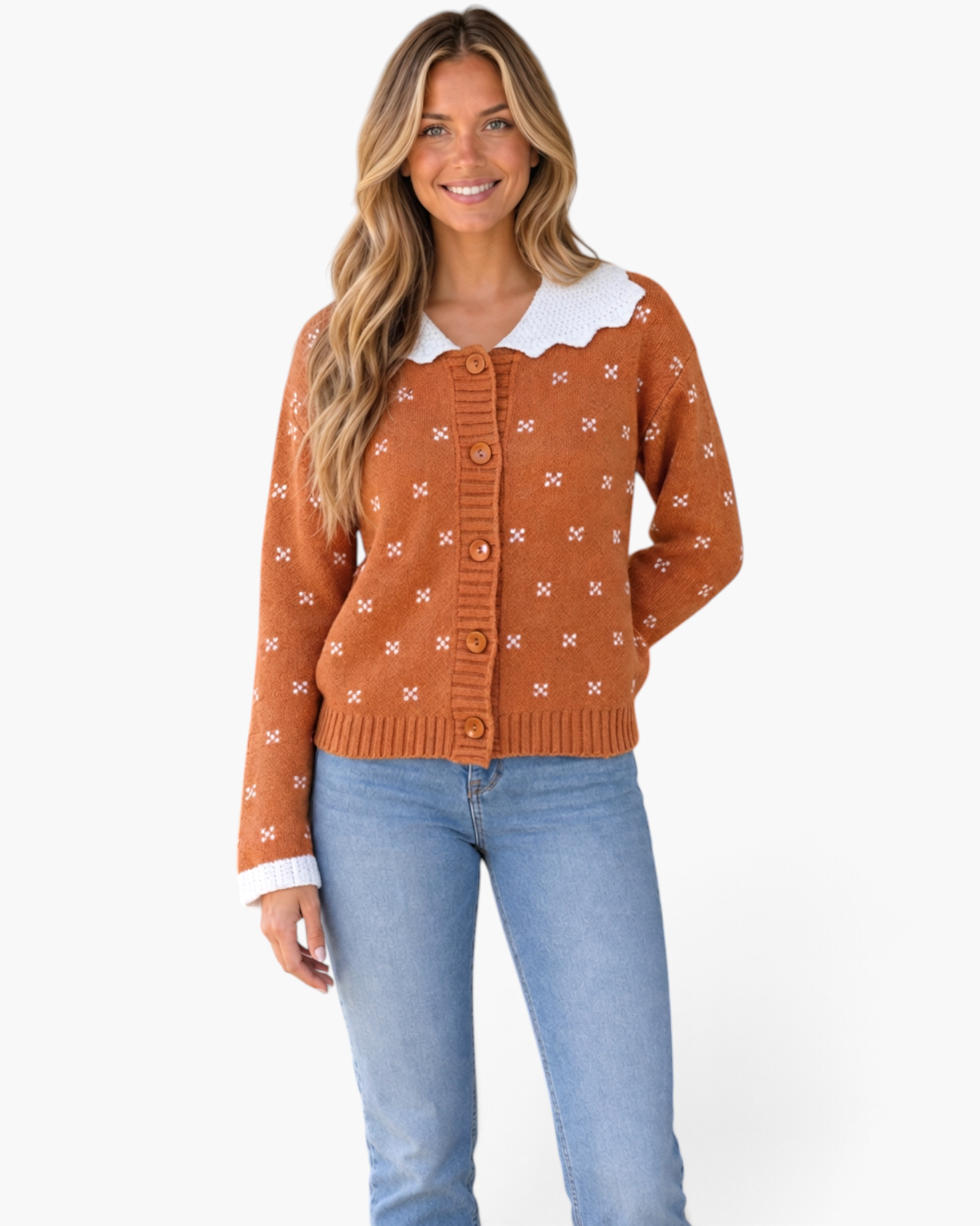 Beach Rose Co. rust cardigan with white knit motifs, scalloped collar, and button-front, worn with blue jeans.