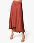 Beach Rose Co. rust-colored washed poly silk midi swing skirt with a fluid drape and high-low hemline.