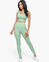Beach Rose Co. sage green ribbed crop top and high-waisted leggings set worn by a model against a white background.