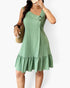 Beach Rose Co. plus size sage green textured dress with an irregular collar, button detail, and a ruffled hem.
