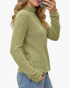 Beach Rose Co. sage green fine knit long sleeve turtleneck sweater with ribbed cuffs on a model