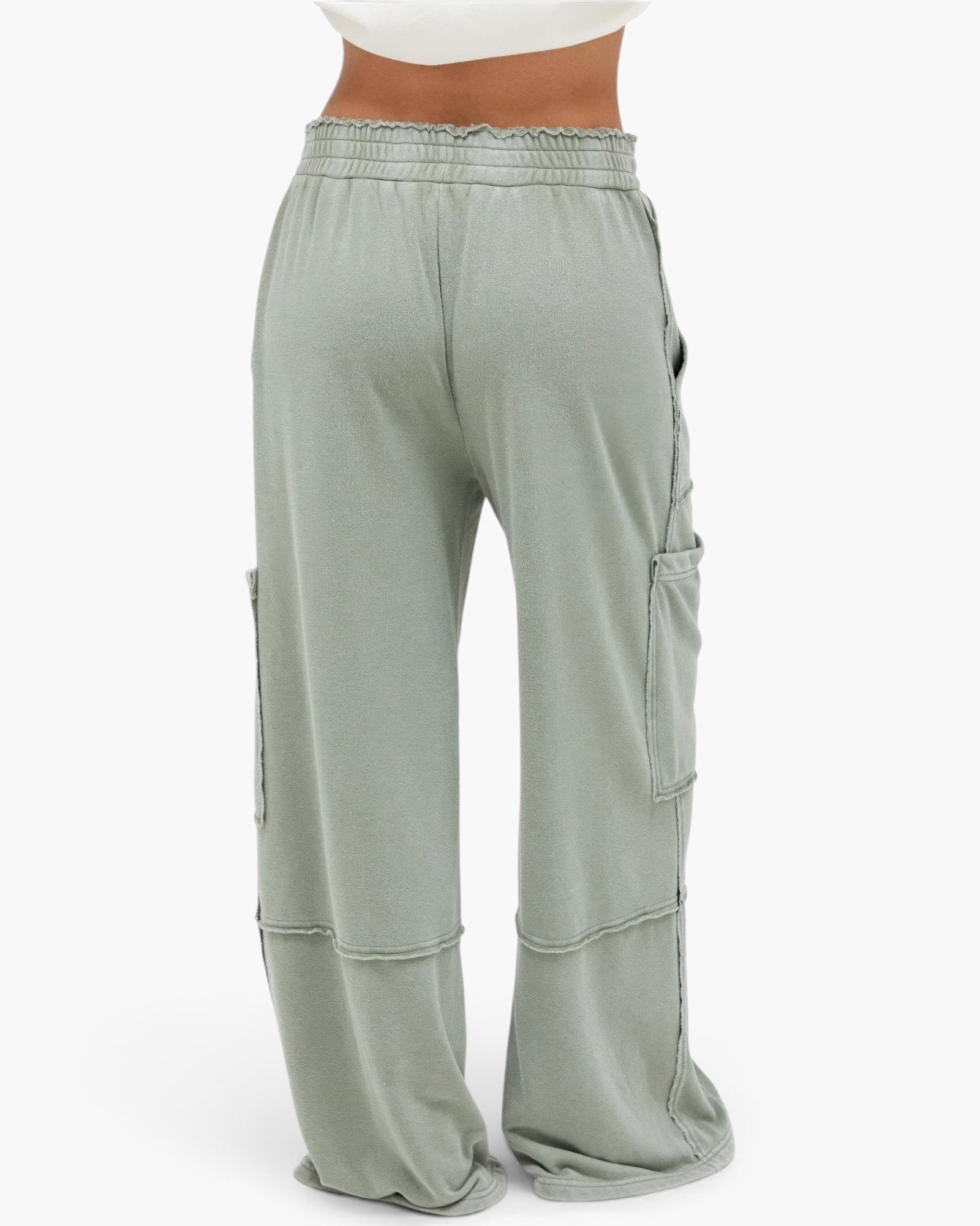 Beach Rose Co. sage green mineral wash cotton cargo pants with a high-rise elastic waist and raw edge pocket details.