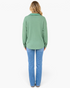 Beach Rose Co. sage green waffle knit button-front shirt with long sleeves and curved hem, back view on a model.