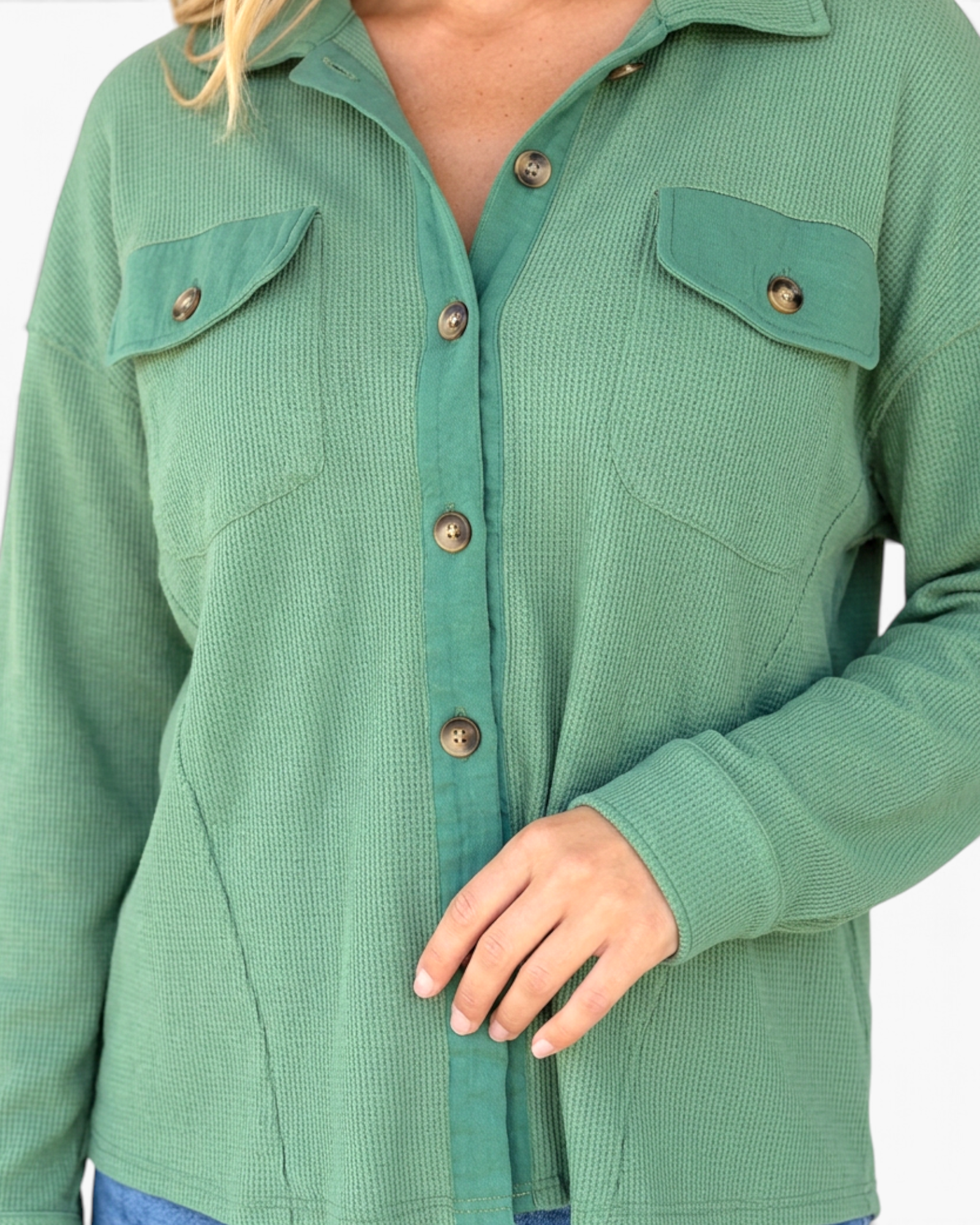 Beach Rose Co. sage green waffle knit button-front shirt with chest pockets and a collared neckline.