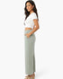 Beach Rose Co. sage green wide-leg cotton pants with side pockets worn by a woman in a white crop top