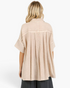 Beach Rose Co. sand cotton gauze shirt with an oversized fit, short sleeves, and a pleated back detail.