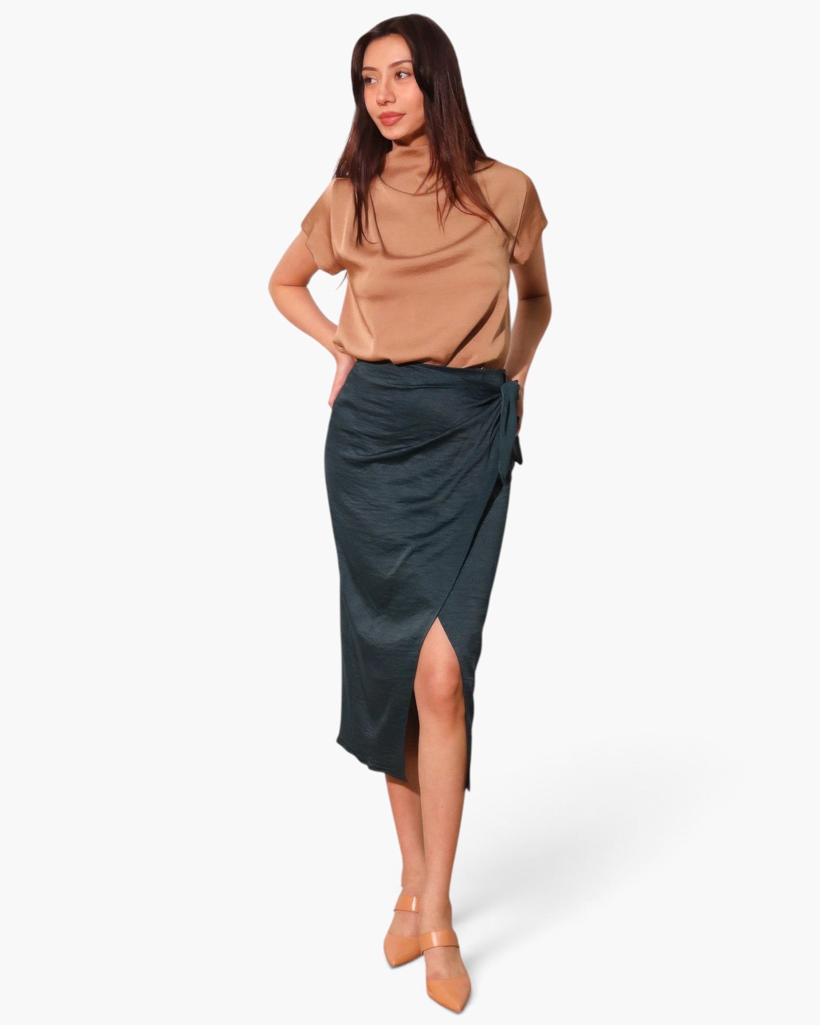 Beach Rose Co. model wearing a dark grey washed satin crepe midi skirt with a side wrap tie and front slit
