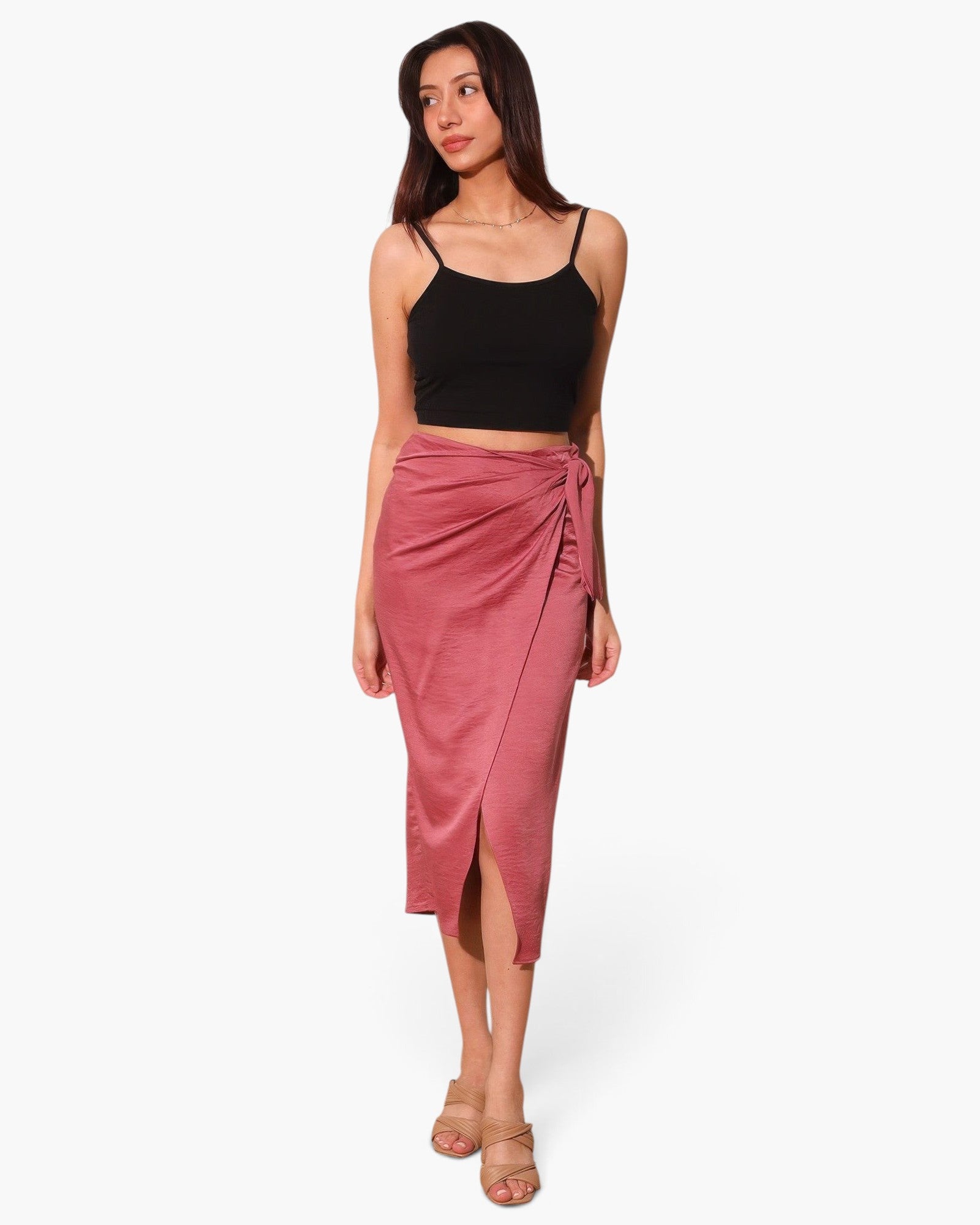 Beach Rose Co. washed satin crepe midi skirt in dusty rose with a side wrap tie, worn by a model with a black top.