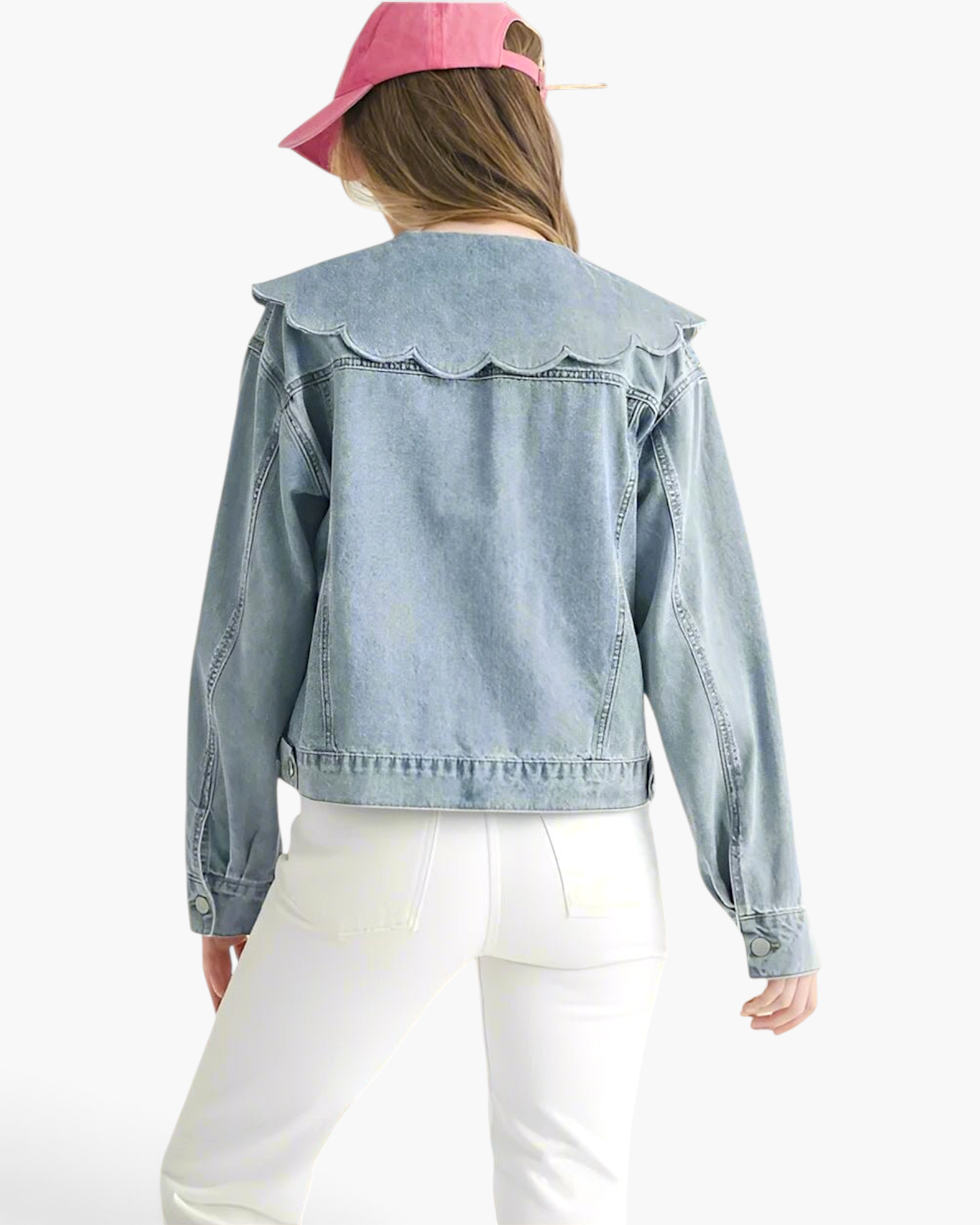 Beach Rose Co. light wash denim jacket with an oversized scalloped collar, worn by a model in a pink baseball cap.
