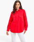Beach Rose Co. scarlet oversized denim shirt jacket with button-front closure and chest pockets on a female model