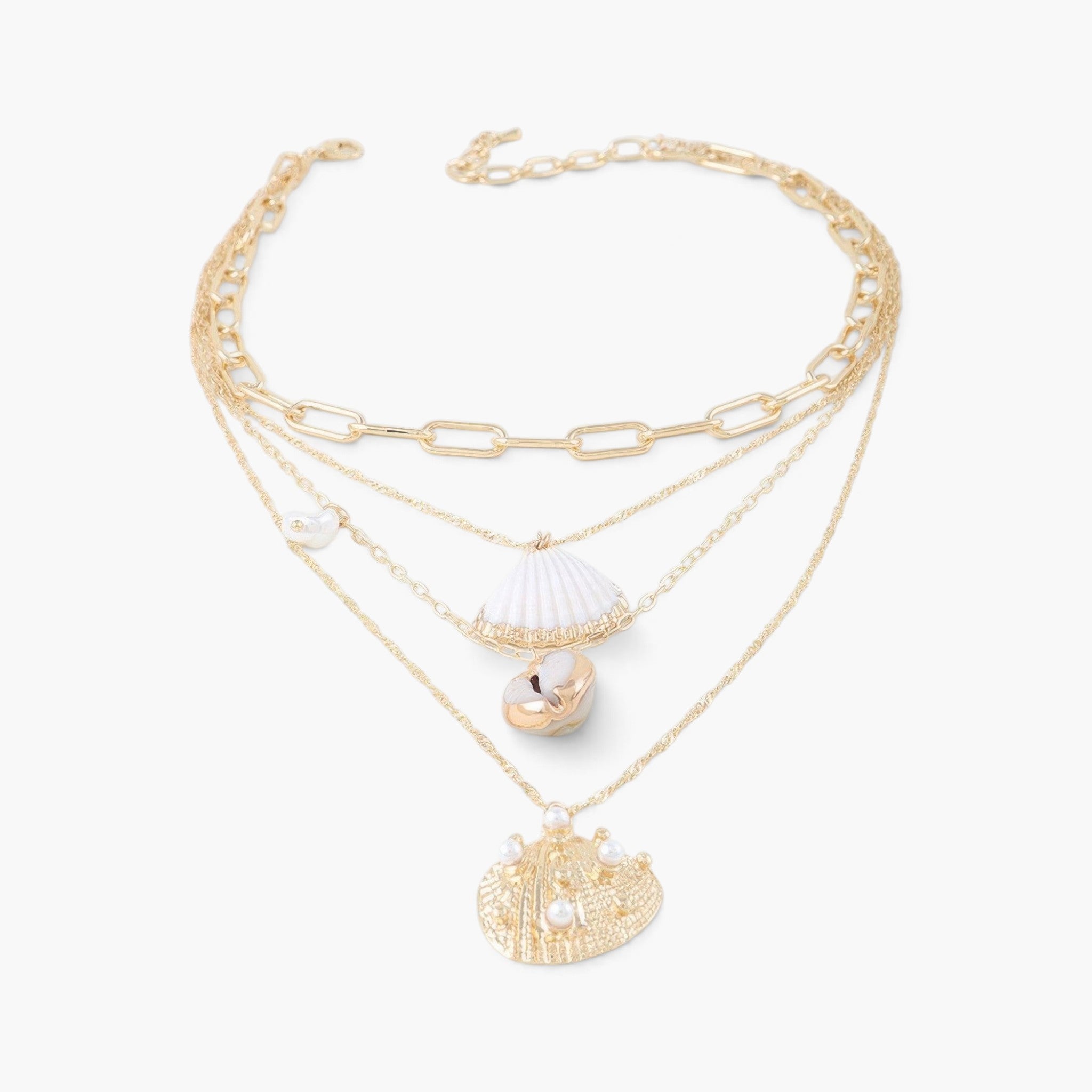 Beach Rose Co. gold chain necklace featuring seashell and starfish charms with pearl accents for a coastal look