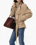 Beach Rose Co. beige short trench jacket with double-breasted buttons, high wrap collar, and buckled waist belt.