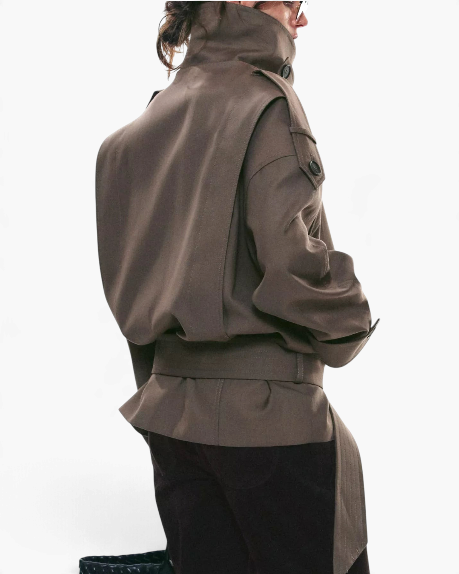 Beach Rose Co. brown viscose short trench jacket with a high wrap collar, shoulder tabs, and a buckled waist belt.