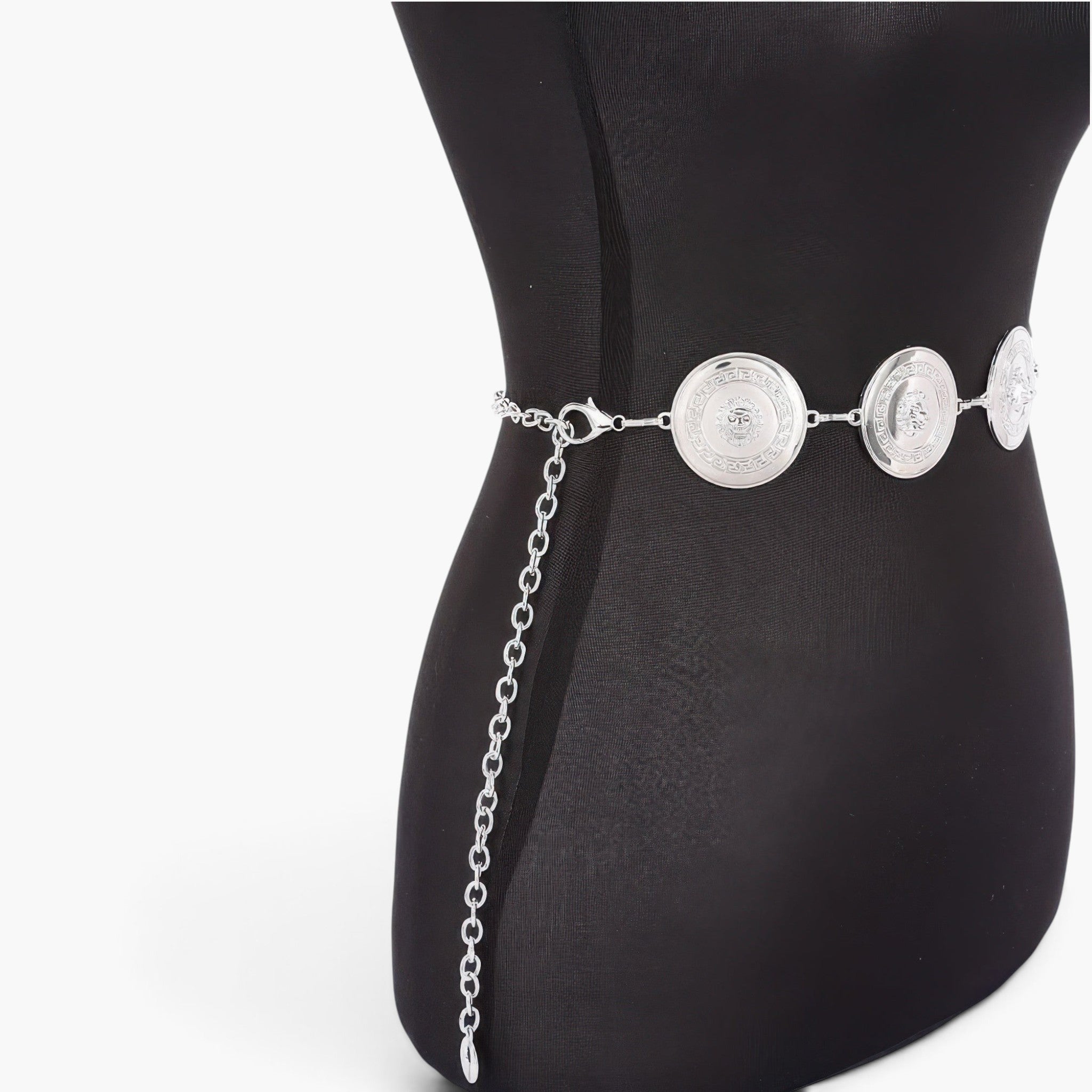 Beach Rose Co. silver multi metal chain belt with circular medallions worn on a black mannequin torso