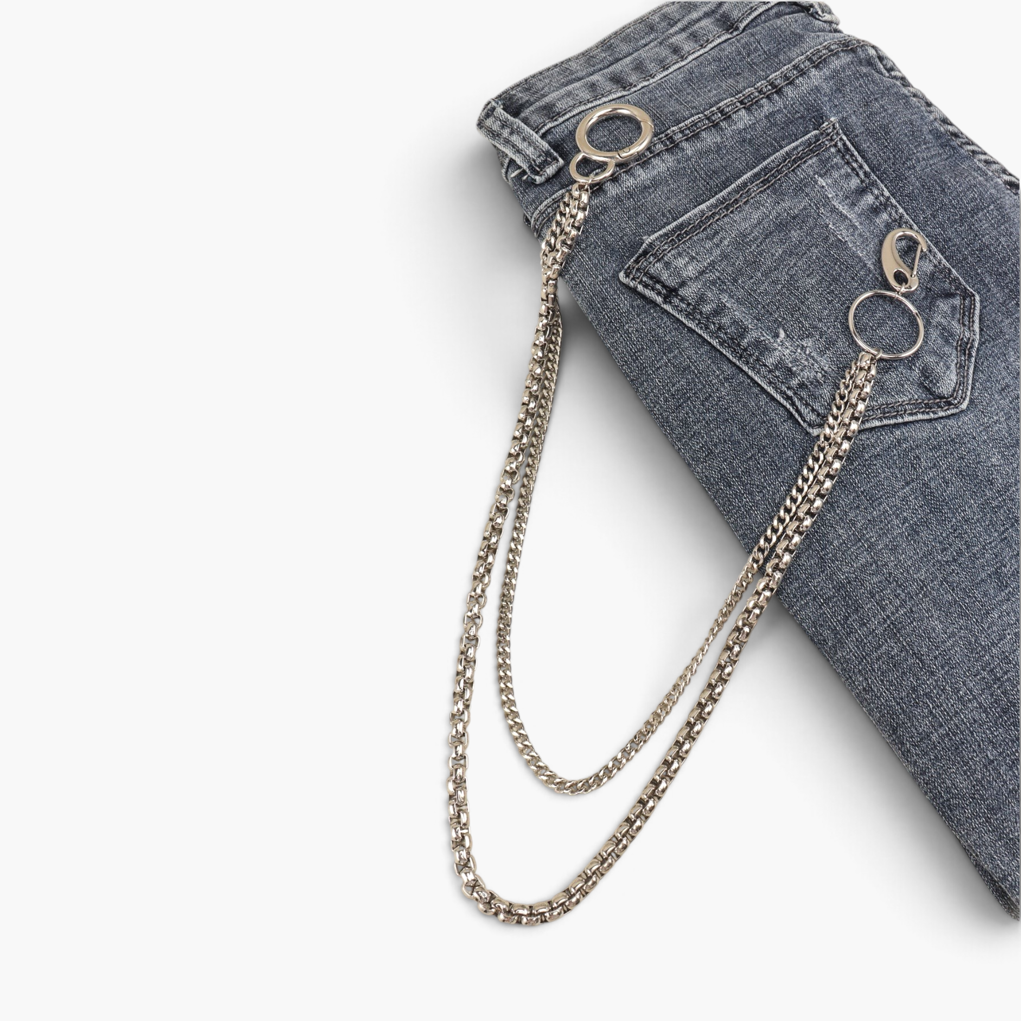 Beach Rose Co. silver-tone double layer pants chain with contrasting links attached to grey denim jeans
