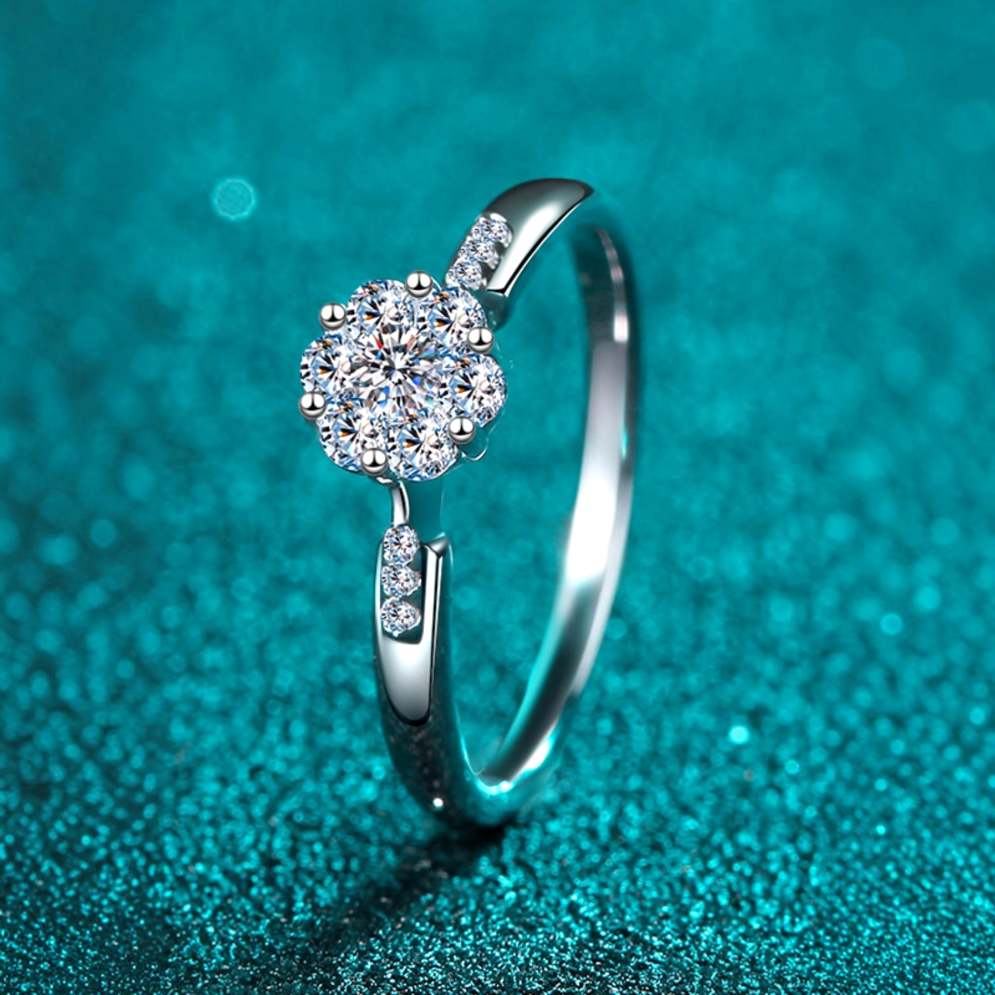 Beach Rose Co. silver floral cluster ring with moissanite and zircon stones on a slim rhodium-plated sterling band.