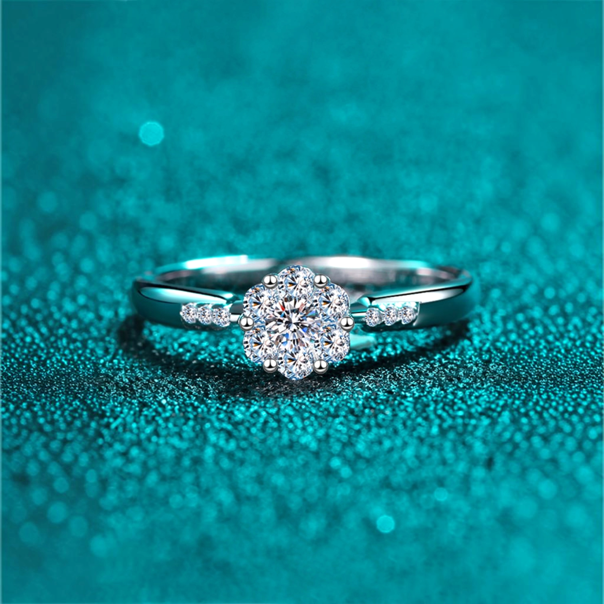 Beach Rose Co. silver floral cluster ring with moissanite and zircon stones on a slim rhodium-plated sterling band.