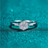 Beach Rose Co. silver floral cluster ring with moissanite and zircon stones on a slim rhodium-plated sterling band.
