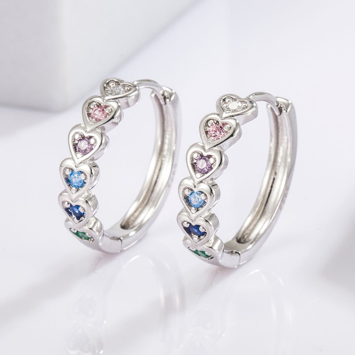 Beach Rose Co. - Silver Inlaid Zircon Heart Huggie Earrings