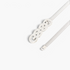 Beach Rose Co. silver metal waist belt featuring a slim ridged band and an intricate interwoven knot buckle design.