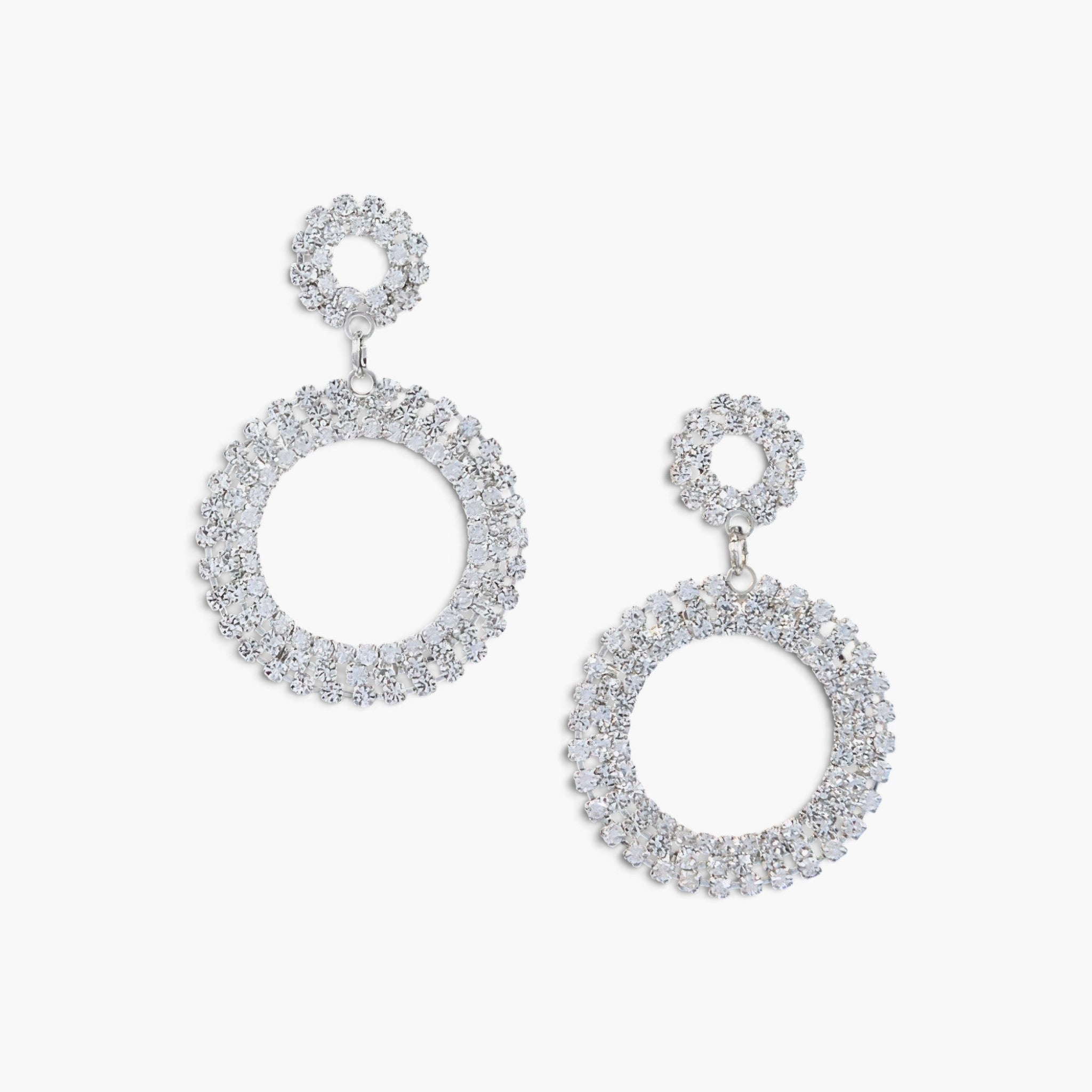 Beach Rose Co. silver tone round circle dangle earrings featuring sparkling rhinestone embellishments.