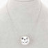 Beach Rose Co. silver round CCB ball pendant necklace on a grey display stand