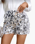 Beach Rose Co. silver sequin shorts featuring mixed-size oversized discs in a straight-leg silhouette.