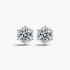 Beach Rose Co. silver starburst moissanite stud earrings with heart-shaped prongs and 4 carat total weight.