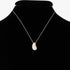 Beach Rose Co. minimalist silver teardrop pendant necklace on a black display bust