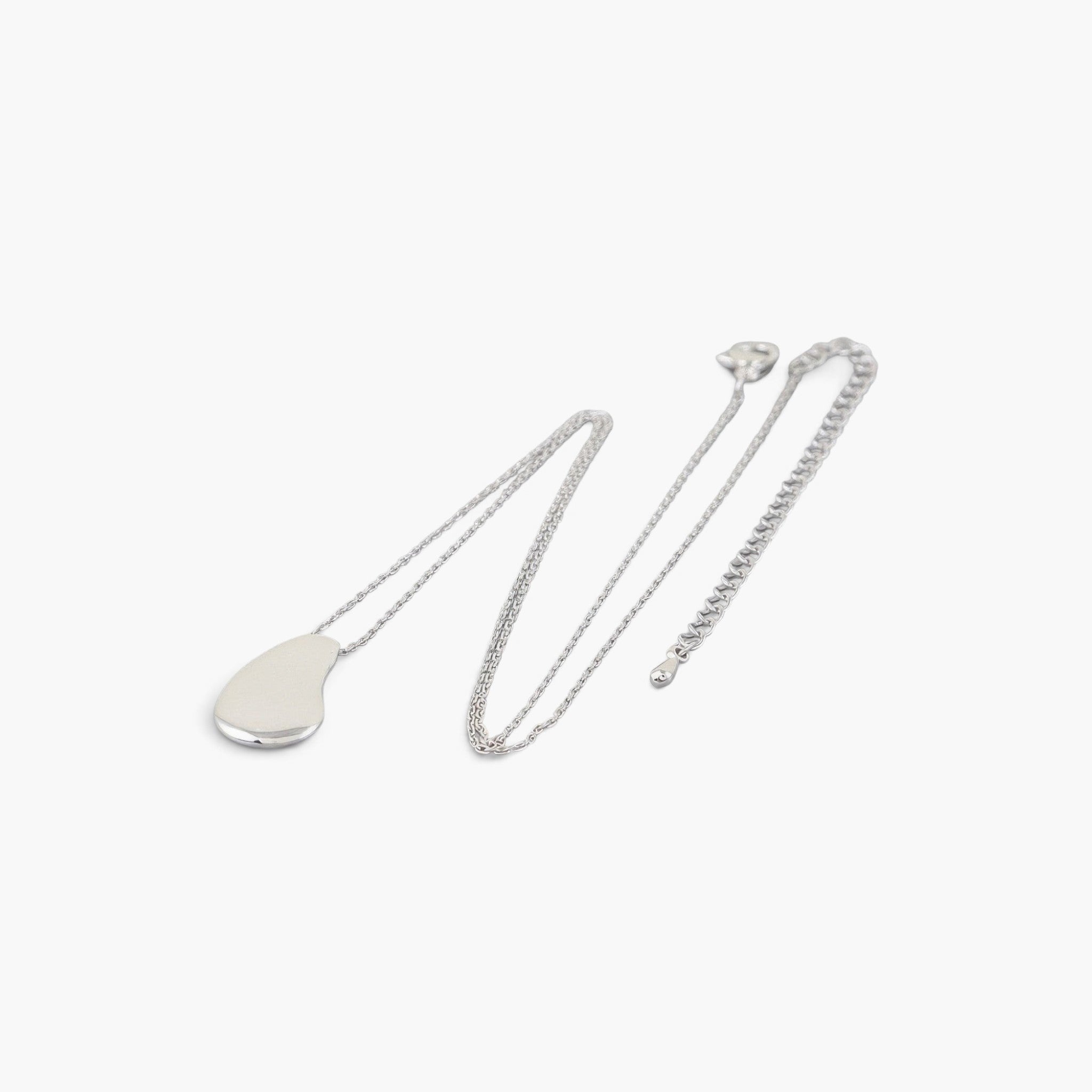 Beach Rose Co. silver teardrop chain necklace with a minimalist disc charm on a delicate chain
